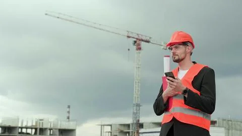 Foreman texting to client via modern gadget Stock Photos