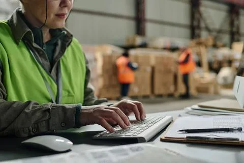 Foreman typing document on computer Stock Photos