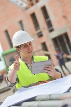 Foreman using digital tablet on construction site Stock-Fotos