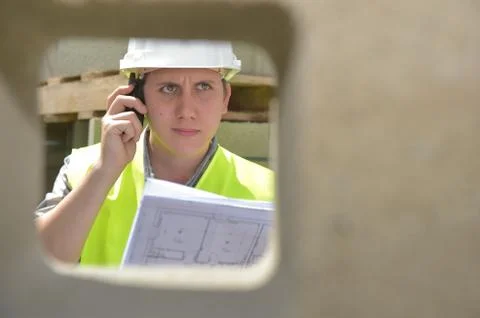 Foreman using walkie-talkie on construction site Stock-Fotos