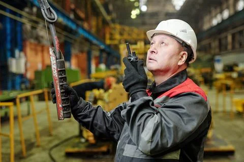 Foreman with wireless radio controlling the work Stock Photos