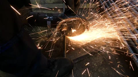The foreman in the workshop uses a grinder Stock Footage 169667123