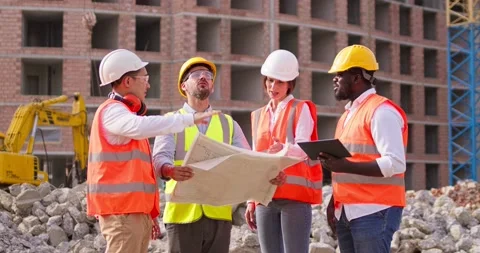 Foremen builder and female architect standing in front of the construction site Stock Footage 172289681