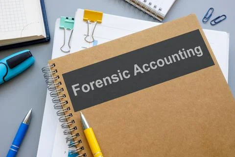 Forensic accounting book and stack of papers. Stock Photos