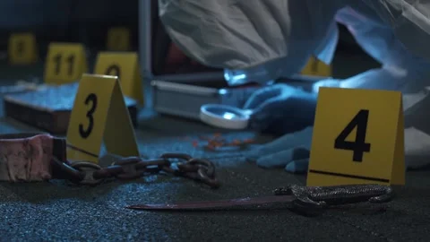 Forensic expert hard working at ritualistic crime scene with occult clues. Stock Footage 286756478