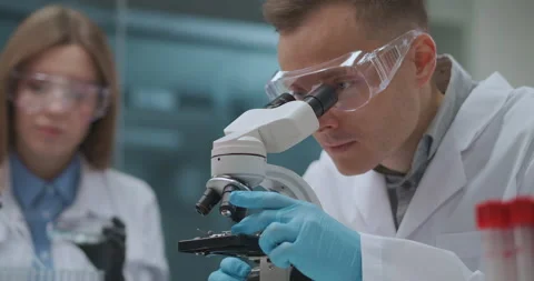 Forensic expert laboratory, man and woman crime specialists are working together Stock Footage 143002568