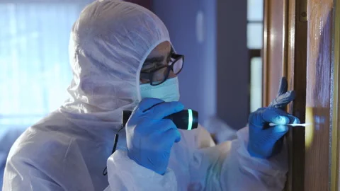 Forensic expert working at the crime sce... | Stock Video | Pond5