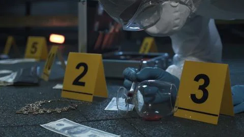 Forensic expert working at crime scene of failed robbery of wealthy apartment. Stock Photos