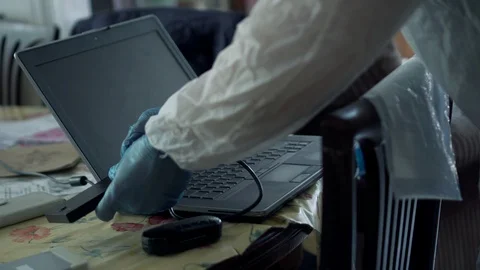 Forensic expertise collecting hard disk drive as a evidence at crime scene Stock Footage 110714489