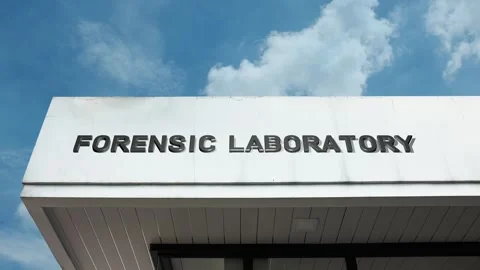 Forensic Laboratory word sign displayed on building with blue sky background Video stock 318664866