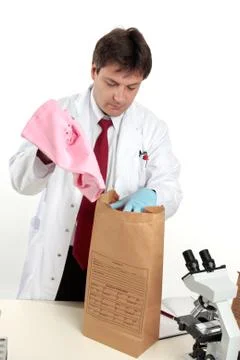 Forensic scientist with evidence Stock Photos