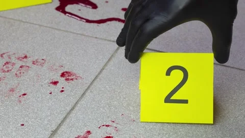 Forensic scientist placing evidence marker Stock Footage 270421917