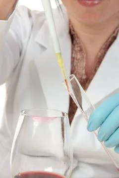 Forensic scientist taking sample from glass Stock Photos