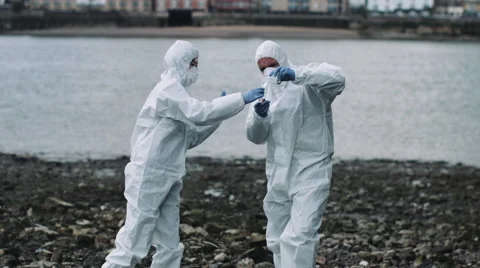 Forensic scientist taking sample at river bank Stock Footage 64188167