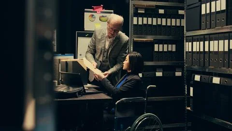 Forensic team extracting DNA samples for modern analysis in archive room 写真素材