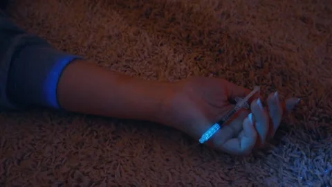 Forensic Ultraviolet Light Scanning a Crime Scene with a Syringe Stock Footage 333851116