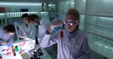 Forensics Researchers Analyzing Blood Sample Laboratory Bacteriologist Working Stock Footage 85500683