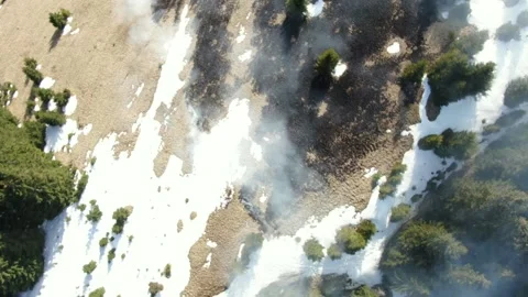 Forest and field on fire in mountains. Aerial view Stock Footage 152254154