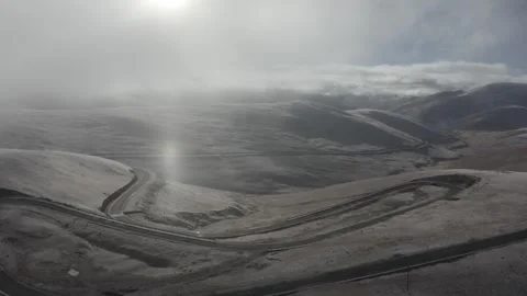 The forest and grassland highway under the sun after the winter snow Video stock 337985379