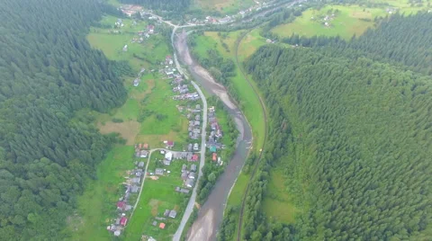 The forest around the village. aerial footage Stock Footage