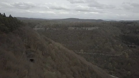 Forest brifge tunnels and cliffs on a cloudy weather 1080 ungraded Stock Footage 105954020