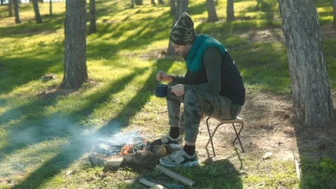 Forest Campfire A Man Prepares a Meal in Nature Stock-Footage 331814106