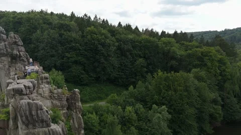 From Forest Canopy Toward The Externsteine Spire 動画素材 339367689