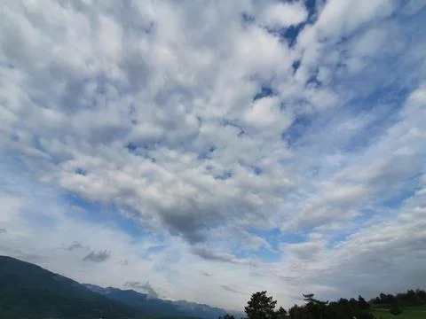 Forest &amp; clouds in the sky Stock Photos