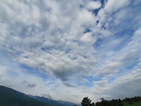 Forest &amp; clouds in the sky Stock Photos