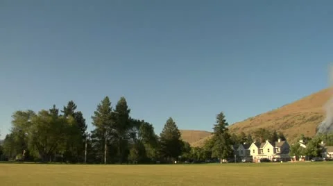 Forest fire burns near small town Stock Footage 21539985