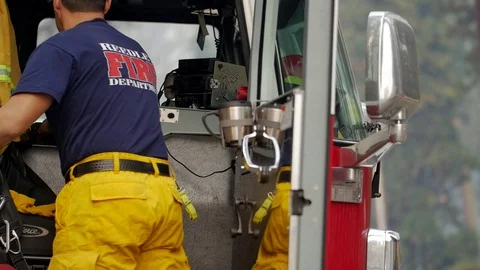 Forest Fire Firefighter Climbs in Engine Stockbeeldmateriaal 74275819