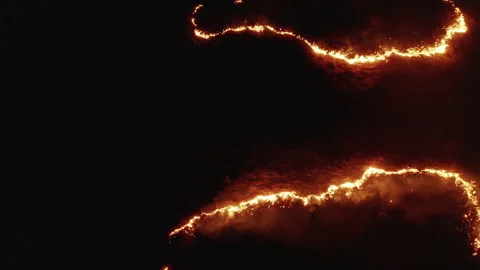 Forest fire at night, aerial drone shot, burning field of dry grass in flame. Stock Footage 190736041