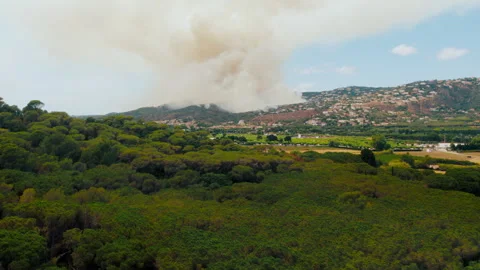 Forest fire in spain gets close to village or city Stock Footage 274579652