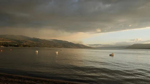 Forest Fire time lapse dusk burning trees on a mountain- lake view 4k. Stock Footage 96495110