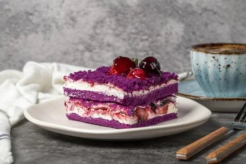 Forest fruit cake slice on dark background. Strawberry, blackberry and raspbe Stock Photos