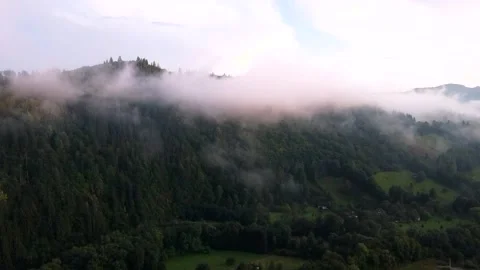 Forest on Hill Covered in Beautiful Clouds, Aerial View Stock Footage 164258156