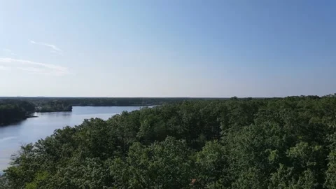 Forest with lake view and blue sky from above. 스톡 동영상 133433248