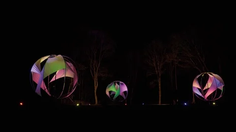 Forest lighting in the park. Glowing balls at night in the form of a sail. Stock Footage 125702113