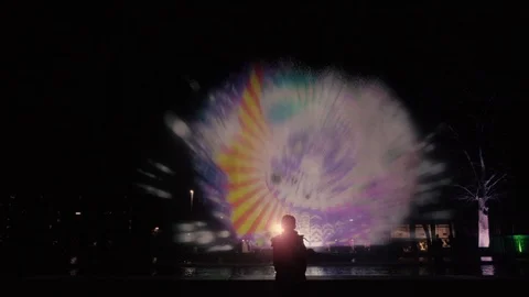Forest lighting in the park. Light projection on the fountain in the park. Stock Footage 125702044