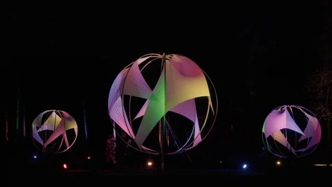 Forest lighting in the park. Round glowing balls in the form of a sail. Stock Footage 125702385
