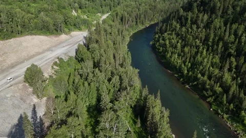Forest, mountains, and river; tourists are traveling in a car. Stock Footage 345184690