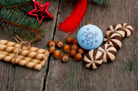 The forest nutlets and baking decorated with a coniferous branch Stock Photos
