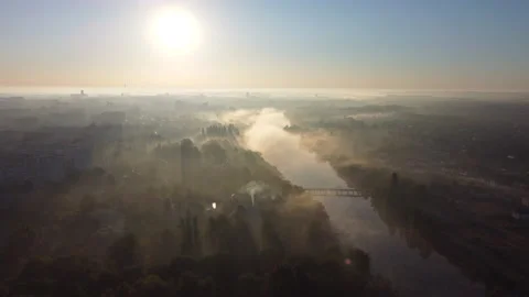 Forest park trees, river and many high-rise buildings in city in early morning Stock Footage 221367111