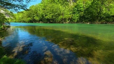 Forest path leads to clear, flowing river. Ovcar Kalbar Gorge, Serbia Видео 333843791