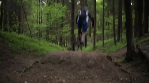 Forest Ramp Jump (over camera) 库存影片 39352342