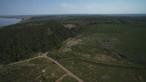 Forest, river and oil rigs from helicopter 01 Stock Footage 36880973