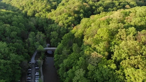 Forest river flyover during sunset pull back Stock Footage 111344330