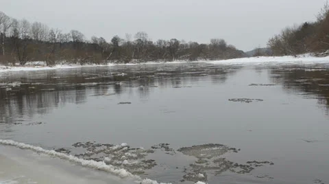 Forest river fragment ice floe floating water winter Stock Footage 22691434
