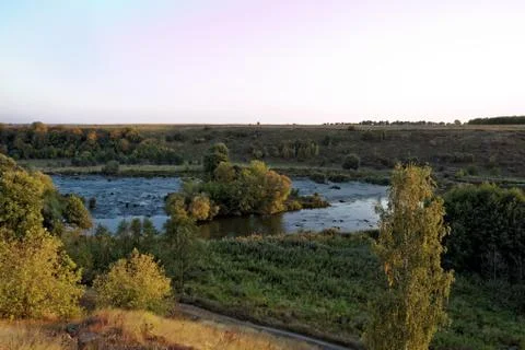 Forest River rapids at sunset. Stock Photos