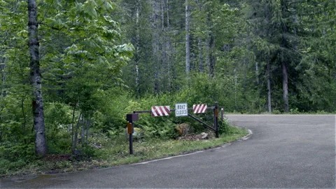 Forest Road Closure with Stop Sign – Restricted Access in Wilderness Stock Footage 310087923